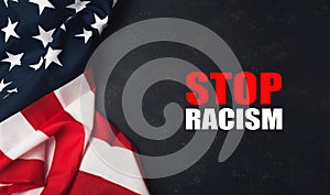 A red and white American flag with the words Stop Racism written underneath it