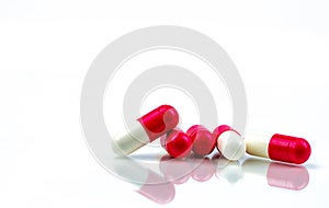 Red-white antibiotic capsule pill isolated on white background. Antibiotic drug resistance. Antimicrobial capsule pills. Pharmacy