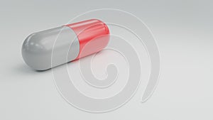 red and white antibiotic medicine pill capsules on table for care health.