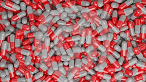 red and white antibiotic medicine pill capsules on table for care health.