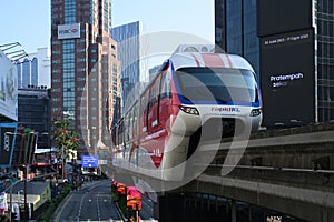 Red and white automated aerial monorail train at Bukit Bintang district of Kuala Lumpur