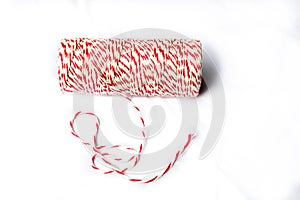 Red and white baker's twine spool