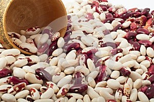 red and white beans with wooden raw capacity