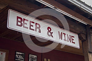 Red and white Beer and Wine Sign