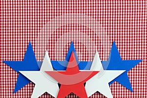 Red, white and blue stars border red checkered (gingham) background