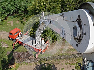 Red and white boom lift truck