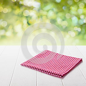 Red and white checked cloth on a garden table