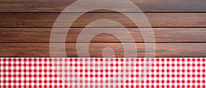 Red white checkered picnic tablecloth on wooden table, banner, copy space. 3d illustration