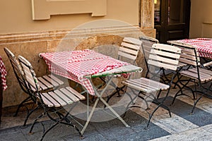 Red and white checkered tablecloths on cafe foldable tables