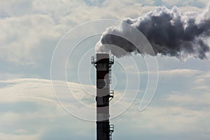 Red and White Chimney Smoking on Cloudy Sky Background