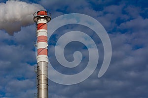 Red and White Chimney Smoking on Cloudy Sky Background