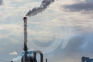 Red and White Chimney Smoking on Cloudy Sky Background