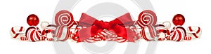 Red and white Christmas baubles, bows and candy cane border