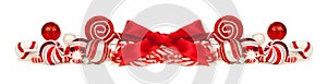 Red and white Christmas baubles, bows and candy cane border photo