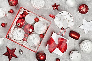 Red and white Christmas baubles in a box