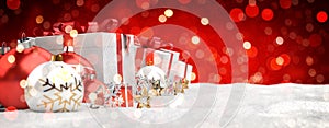 Red and white christmas gifts and baubles lined up 3D rendering