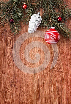 Red and white Christmas ornaments on a rustic wooden background. Xmas card. Happy New Year