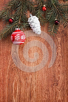 Red and white Christmas ornaments on a rustic wooden background. Xmas card. Happy New Year. Top view