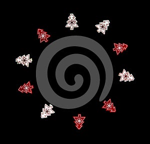 Red and white Christmas tree ornaments isolated on black