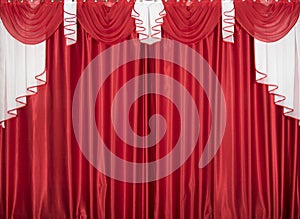 Red and white color lambrequin and curtains, silk texture with folds, fabric background