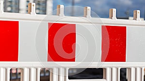 Red and white colored plastic barrier