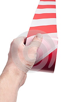 Red white cordon tape in hand