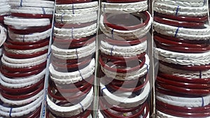 Red and white counch shell bangles popularly khnown as sankha an pola is worn by married bengali women.