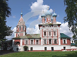 Red-and-white Cristian church with blue domes