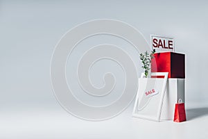 red and white cubes, paper bag and sale signs, summer