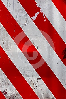 red and white diagonal stipes on flat steel sheet - caution road sign