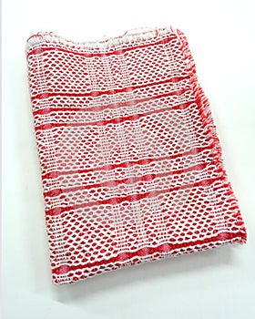 Red and White Dish Towel against a White Background