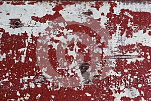 Red and white distressed wooden painted texture. Painted texture in obsolete paint.