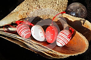 Red and white Easter eggs in pinna nobilis, noble pen shell, macro photography, closeup