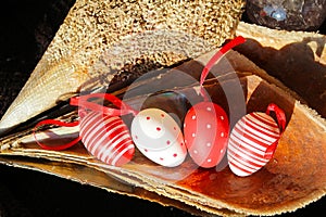 Red and white Easter eggs in pinna nobilis, noble pen shell, macro photography, closeup