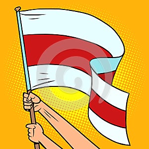 Red and white flag of Belarus in the hands