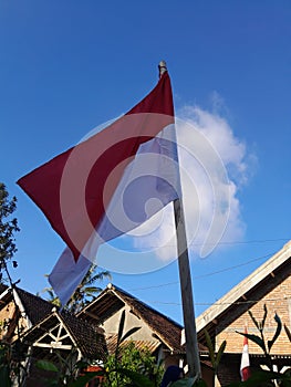 the red and white flag every August 17 is hoisted in front of houses to commemorate Indonesia& x27;s independence day