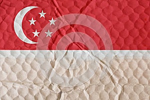 Red-white flag of the Republic of Singapore on an uneven texture