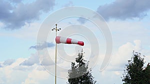 red and white flag. Wind designator to indicate direction of wind on helipads