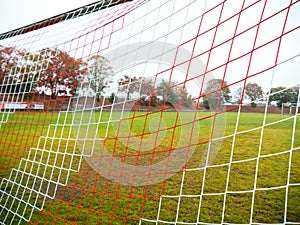 Red and white goal net of Rural soccer pitch in Germany