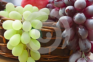 Red and white grape branch in a basket