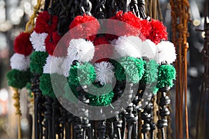 Red white and green colored whips at the farmers market for sale