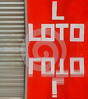 red background with capital upper case letters spelling LOTO photo