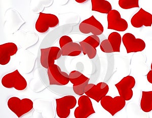 The Red and white hearts on white textured fabric background