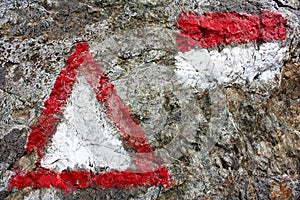 Red and white hiking trail signs symbols