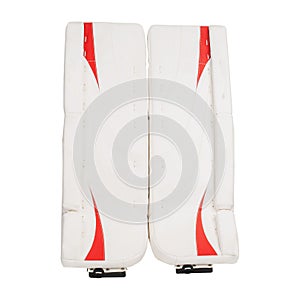 Red and white ice hockey goalie protective leg pads isolated on white background