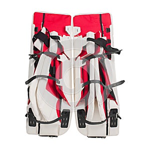 Red and white ice hockey goalie protective leg pads isolated on white background