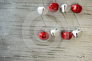 Red and white jingle bells on silver