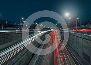 Red and White light trails of cars on a freeway