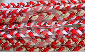 Red and white martenitsi on outdoor market for martenici. Martenitsa or martenitza is given on 1st March as symbol of health and p photo