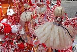 Red and white martenitsi on outdoor market for martenici on the street. Martenitsa or martenitza is given on 1st March as a symbol photo